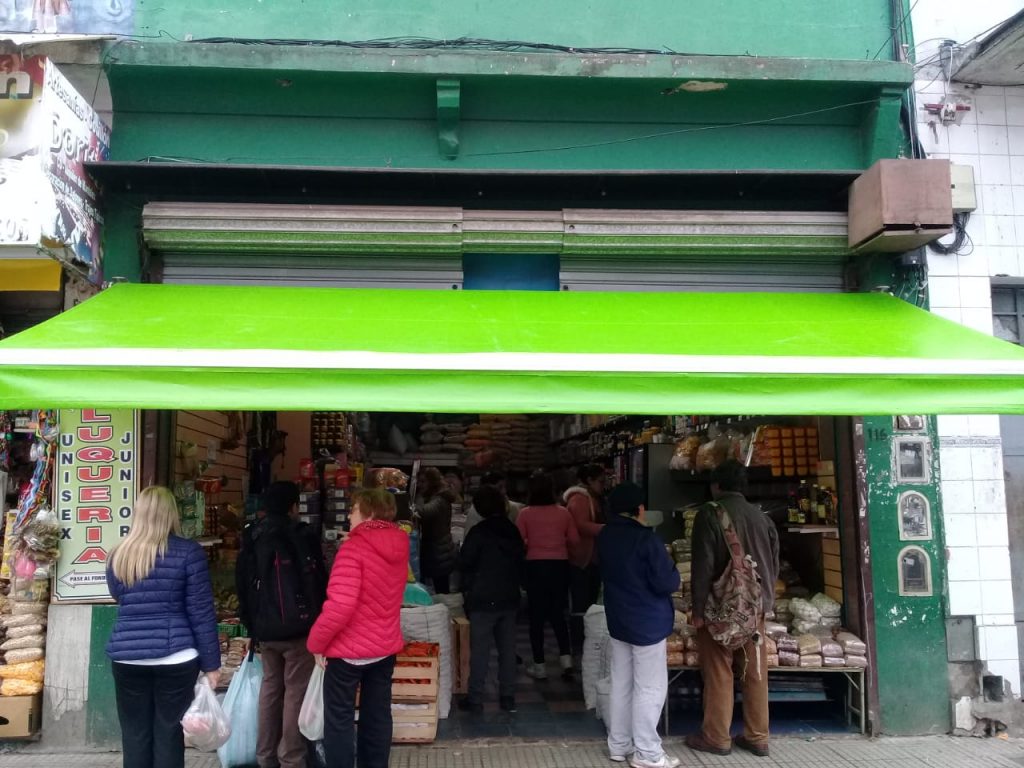 Toldo brazos invisibles con lona color verde